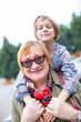 © DariaTrofimova - Elderly grandma with  granddaughter walking in   park.