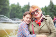 © DariaTrofimova - Portrait of   stylish elderly woman with grandchild  on   spring day in   park.
