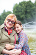 © DariaTrofimova - Portrait of   stylish elderly woman with grandchild  on   spring day in   park.