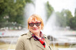 © DariaTrofimova - Old woman in stylish clothes   walking on   street.