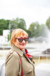 © DariaTrofimova - Old woman in stylish clothes   walking on   street.