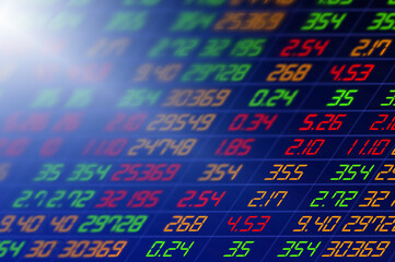 Stock exchange market business concept with selective focus effect. Display of Stock market quotes. Red numbers on the electronic board.