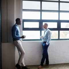 Id like us to explore some of your ideas further. Shot of two businessmen having a discussion in an office.