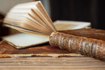 Poster - an old book with an old leather cover.