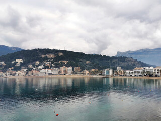 Wall Mural - Scenic view of Port de Soller, Mallorca, Balearic Islands, Spain against mountains on a gloomy day