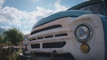 Blue Rusty Truck's Headlights. Slow Motion, Dolly Shot. 