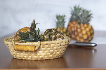 Wall Mural - Photo of pineapples in the basket