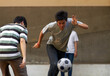 © Vitchanan P/peopleimages.com - Dribbling to the goal. Young asian males playing soccer outside.