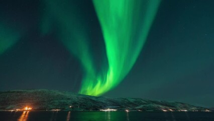 a very strong northern lights activity captured on a time lapse video over the northern scandinavia 