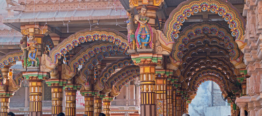 the brightly decorated burmese teak archways in the hindu shri swaminarayan temple in ahmedabad, ind