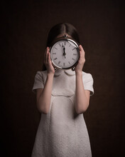 It Is Time -  Two To Twelve - Girl In White Holding Clock