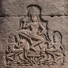 Stone-carved Bas-relief With Dancing Apsaras In Ancient Khmer Temple In Angkor, Siem Reap, Cambodia