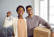 © Studio Romantic - Portrait of overjoyed young multiethnic family buyers hold keys to new home moving in together. Smiling multiracial couple clients celebrate relocation buying house or flat. Real estate concept.