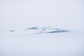 frozen lake landscape in farnebofjarden national park in north of sweden.
