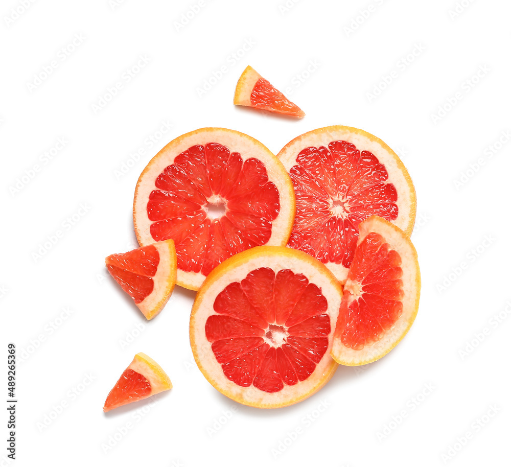 Slices of tasty ripe grapefruit on white background