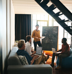 Poster - Working through their grand plan. Shot of a businesswoman giving a presentation to her colleagues in an office.