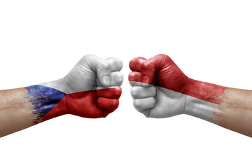 Two hands punch to each others on white background. Country flags painted fists, conflict crisis concept between czechia and monaco