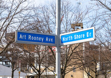 Street Signs For North Shore Drive And Art Rooney Avenue Outside Of Heinz Field On The North Side Of Pittsburgh, Pennsylvania, USA On A Sunny Winter Day