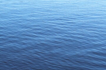 Calm light blue water surface in Florida river, natural background