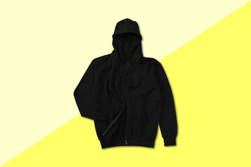 Top view of black zip hoodie with flat lay concept isolated on plain background