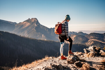 Traveler hiking  with backpacks. Hiking in mountains. Sunny landscape. Tourist traveler on background view mockup. High tatras , Poland