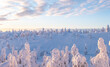 Sunrise over snowy forest and highlands in Lapland. Winter landscape in the morning.