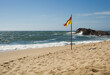 The yellow-red flag on the beach - Portugal