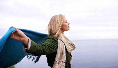 Sticker - Morning contemplation. Shot of a beautiful young woman standing at the ocean.