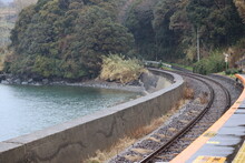 The Railroad That Runs Through The Forest Along The Sea Is The Scenery Of Omura Bay In Japan