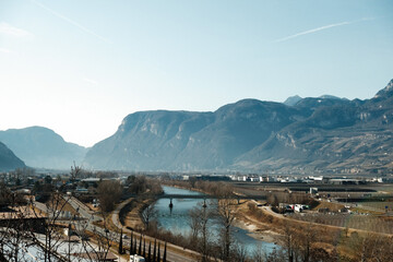 Sticker - Beautiful view of the river near a bridge with mountains background in Bolzano, Italy