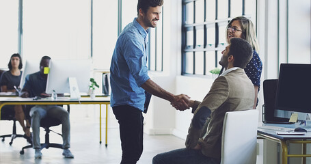 Aufkleber - Lets get to work. Cropped shot of two businessmen shaking hands while working in their office.