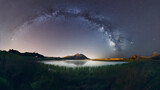 Fototapeta Natura - A beautiful landscape view of half cloudy circle on  reflecting on water at night