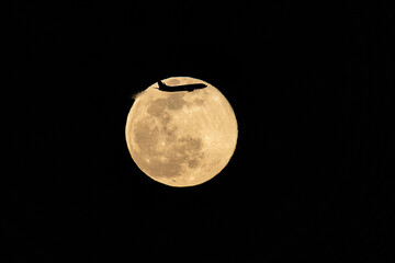 airplane in the full moon