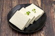 © enezselvi - Sliced Feta cheese with herbs on wooden background. Close-up breakfast cheese