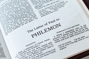 Poster - Philemon open Holy Bible Book close-up. New Testament Scripture. Studying the Word of God Jesus Christ. Christian biblical concept of faith and trust.	