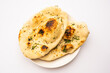 naan, nan bread served in a plate, isolated
