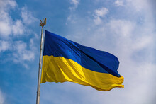 Ukrainian National Official Flag On Blue Sky Background