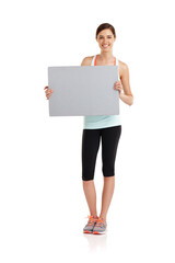 Canvas Print - Score yourself a healthier body. Shot of a fit young woman isolated on white.