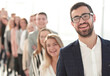 © ASDF - smiling business man standing in front of a group of diverse young people