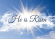 He is risen background with sunburst in blue sky design