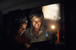 © Tasneem H/peopleimages.com - What is our next big move. Shot of two businesswomen using a digital tablet together in an office at night.