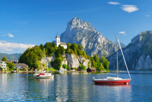 A Yacht Against The Backdrop Of Mountains And An Old Castle In Switzerland. A Popular Place To Travel And Relax. .
