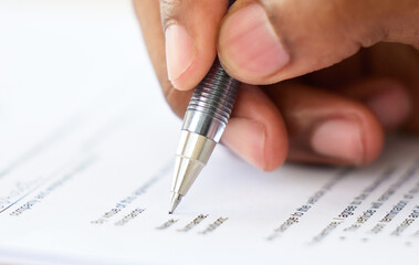 Poster - Make sure you get insured. Shot of an unrecognisable businessman filling in a form on a desk in an office.