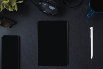 Poster - top view working desk with keyboard headphone and tablet on black table background