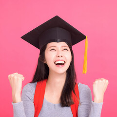 Wall Mural - Happy Asian  college student in Graduation cap  with success gesture