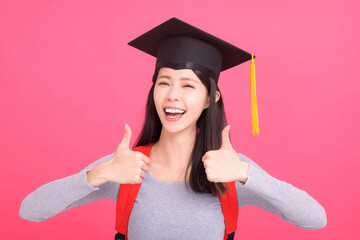 Wall Mural - Excited asian  girl college student in Graduation cap  with success gesture