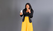 black pretty businesswoman showing reaction to message received with mobile phone