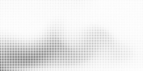 Wall Mural - Halftone dotted background. Black dots in modern style on a white background.