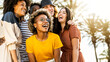 © Davide Angelini - Multiracial young people laughing out loud on a sunny day - Cheerful group of best friends enjoying summer vacation together - Human resources, youth lifestyle and summertime holidays concept