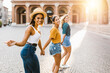 Young group of happy women having fun together on Italy during summer vacation - Joyful female friends running running in old town in an italian city - Happiness, friendship and holidays concept